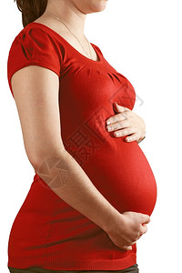 新的出生一位怀孕女双手放在肚子上的相片白种人图片