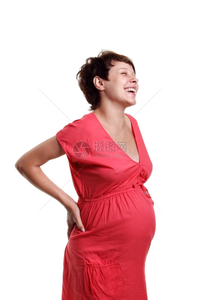 女孩美丽的身穿白色底红衬衫的怀孕年轻妇等待图片