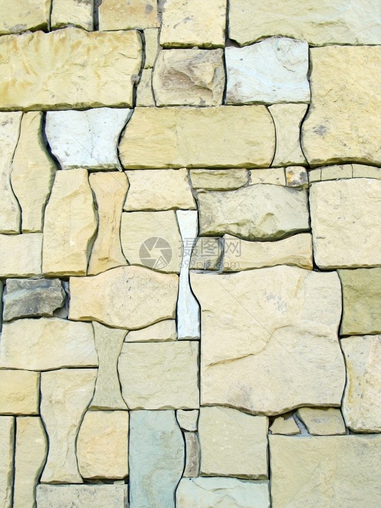 质地砖配有奇形天然石头浅棕色和蜜蜂的完美石墙绿色图片