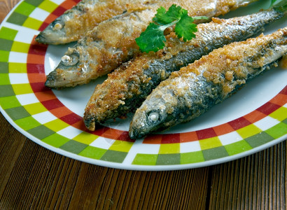 煮熟的食物Aliciripienealforno烤凤尾鱼西里美食海图片