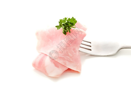 香菜气照片美味的火腿切片用叉子包在白色背景上小吃图片