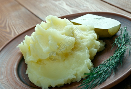 进入一顿饭酱Aligot由融化的奶酪制成盘子混入土豆泥法国菜图片