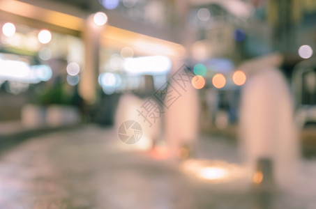 店铺城市购物中心抽象模糊的喷泉以购物商场布OKh灯为背景图片