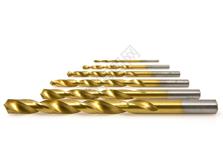 金子捻白色背景上的一组钻头比特螺旋图片