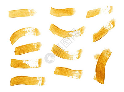 飞溅刷子金的一组在白色背景上隔离的金色彩划线一组金绘画纹图片