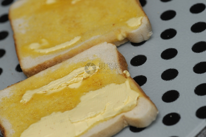 饮食脆皮碳水化合物含黄油融的吐司图片