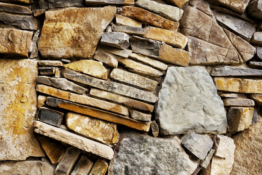 自然屏障边界石墙碎片与粗糙的石头图片