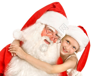 男士孩子appy小女孩在白色背景下拥抱圣诞老人微笑图片