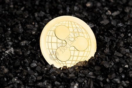 银行业投资黑沙子背景加密货币连锁金的摇盘XRP硬币瑞波图片