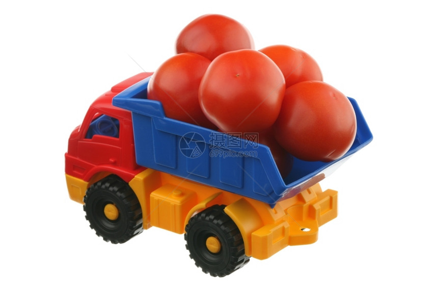 蓝色的卸货蔬菜番茄和卡车图片