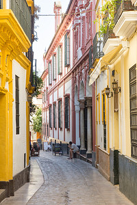 海伦安达卢西亚欧洲的城市塞维勒斯古城一条狭小街道背景