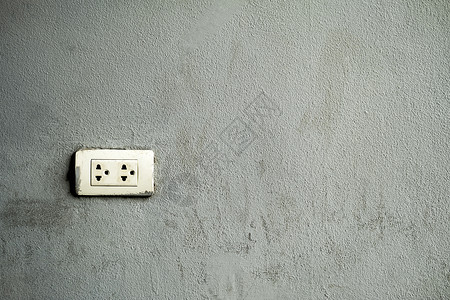 电气交流安装在水泥背景上的电源插件Name出口高清图片