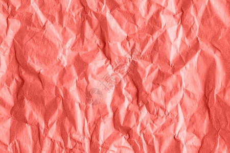 珊瑚色调抽象背景中皱褶粗糙包装纸的纹理珊瑚色调抽象背景中皱褶粗糙包装纸的纹理墙艺术皱巴的背景图片