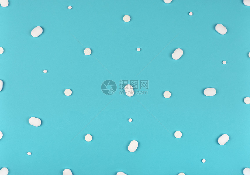 蓝色背景的白药丸图案蓝色背景的平板浅面底片图案蓝色背景的医学底片图案治疗抗生素药剂图片