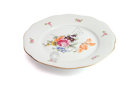 白餐盘鲜花和大浪圆边被隔绝陶瓷用具轮缘图片