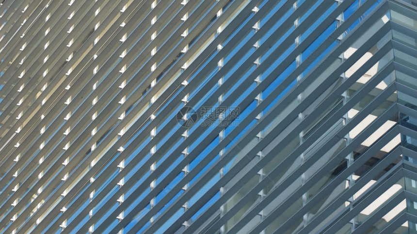 视窗建筑学结构体玻璃窗靠近反映现代建筑蓝色天的玻璃窗前方其背景摘要图片