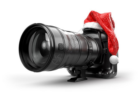 新的人们白色DSLR摄影机装在圣诞老人的红色礼帽上背景图片