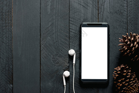 苹果手机白色空的将白屏幕电话放在黑木地板上模拟电话聪明的苹果手机背景