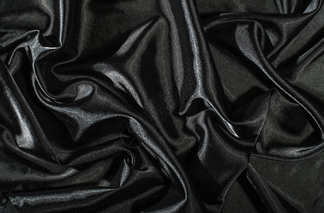 黑色西边面织物背景闪亮的丝绸背景黑暗缎丝滑图片