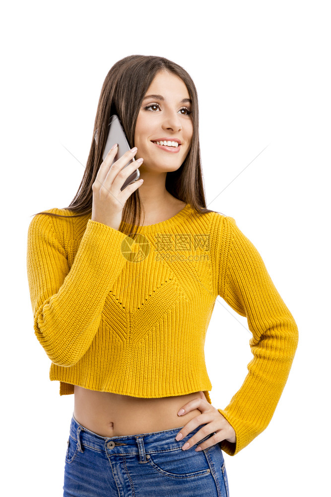 模型美丽的女孩打电话个被白种背景隔绝女微笑图片