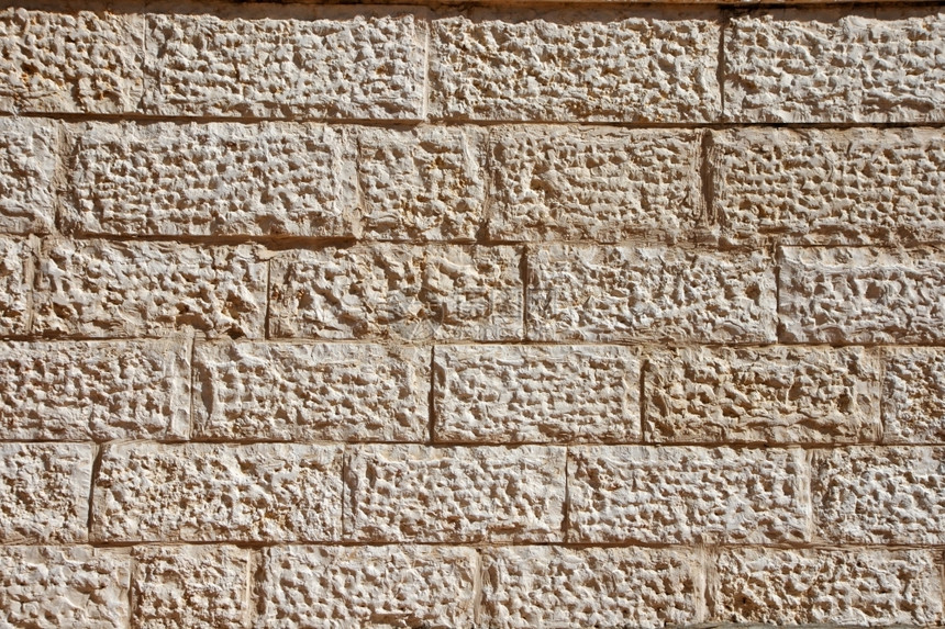 垂直的结石以耶路撒冷块建造的隔离墙质地图片