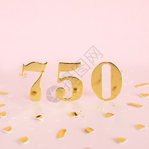 一种750号有粉红背景的金数字和文本的金面体空间钱五十背景图片