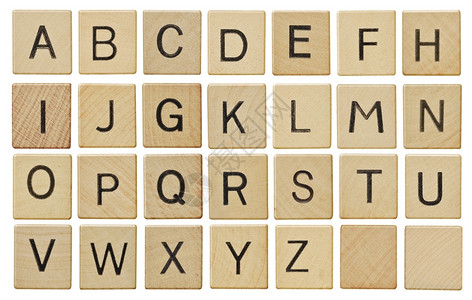 白色的游戏木制碎块上字母在白色上孤立玩图片