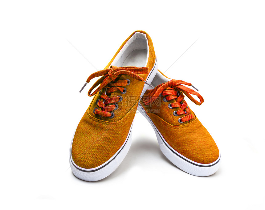 一双橙色帆布鞋在白背景上被孤立有剪切路径一双橙色纸帆布鞋在白背景下被隔离时髦的新户外图片