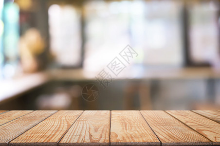 剪辑咖啡店餐厅背景模糊的咖啡厅面前空木板桌图像可以是摆放产品棕色的抽象背景图片