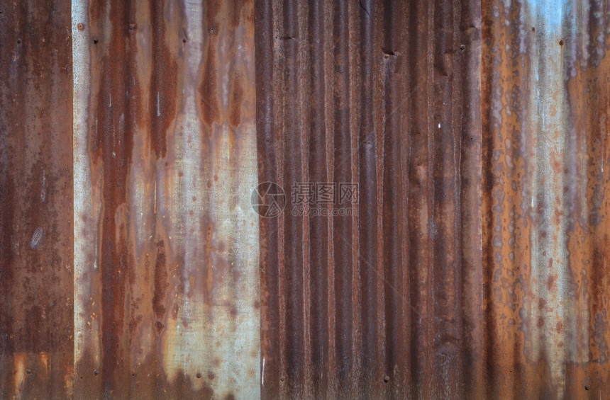 老的Rusty熔铁金属壁背景工业的橙图片