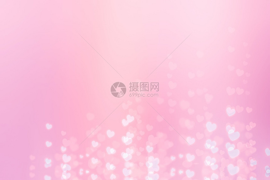 一种粉红色背景上闪亮白红心带有bokeh效应闪耀白色的图片