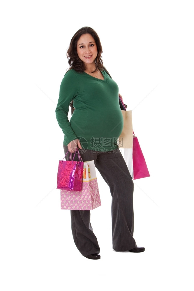 微笑常设美丽的快乐令人兴奋笑容白种人怀孕黑发女在站着时拿购物袋与世隔绝乐趣图片