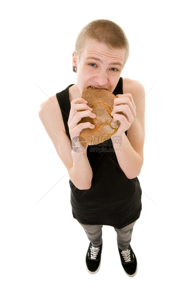 金发一种饥饿的少年吃着白背景孤立的麵包不开心图片
