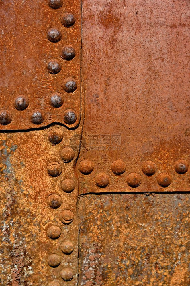 背景和纹理铁质生锈的金属表面有刺合接物工业抽象粗糙的棕色关节图片