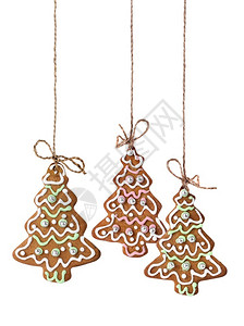 心红丝织物背景的圣诞姜饼装饰盛装的圣诞姜饼红色庆典图片