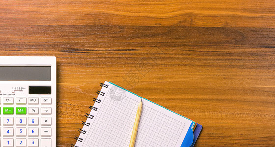 计算笔记本和木制桌上的铅笔美元记纸教育木制的图片