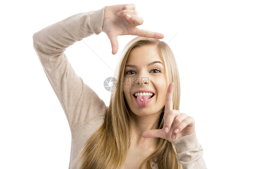 白种人一个年轻美少女做傻脸的演唱室肖像快乐的随意图片