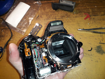 电气子的镜片修理数码SLR摄像机和微电子图片