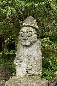 艺术在韩国济州岛上Hamadan先生的雕像是育力一个共同象征夫妇们会为好运而摸他的鼻子脸公园背景图片