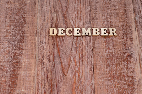 12月份日历模板木质背景上的月份名称日历模板工艺一种为了背景图片