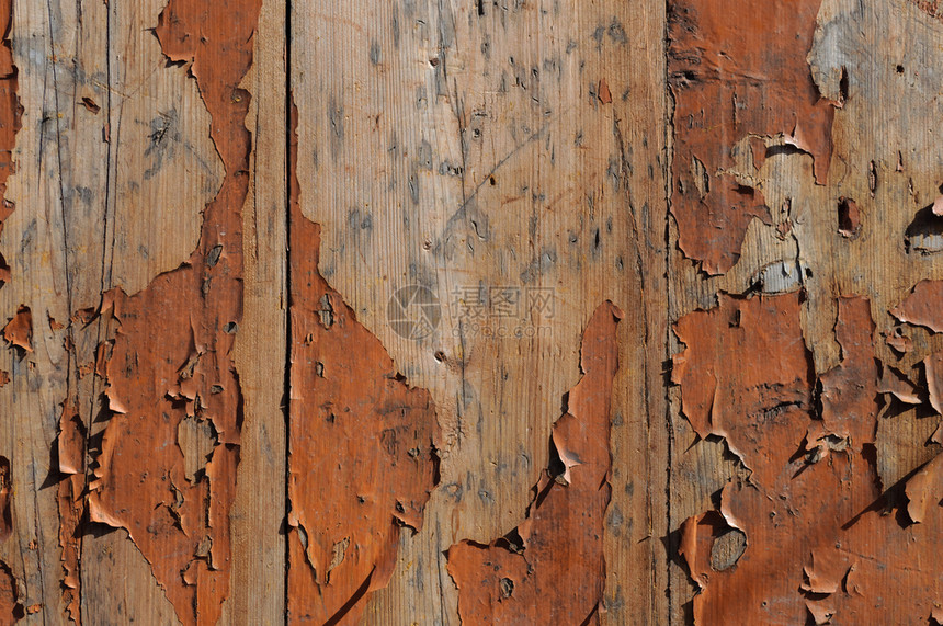 抽象的复古在旧木板上涂红色油漆将涂在旧木板上剥离图片