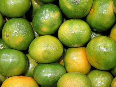 新鲜绿色橘子美味的热带水果生剥成熟图片
