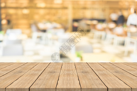 可伸缩餐桌餐厅咖啡店背景模糊的空棕色木板复制您产品可补装的空间Name展示店铺设计图片