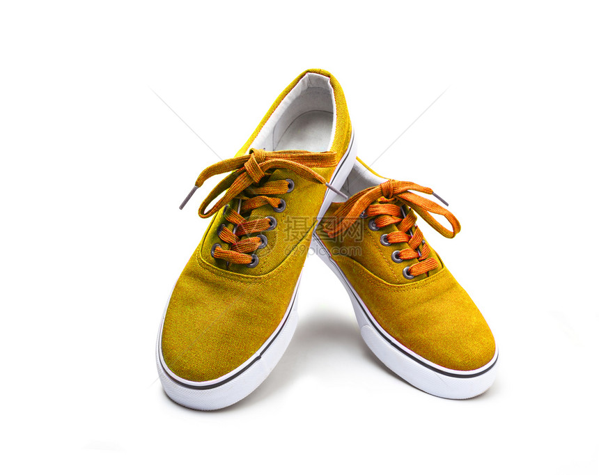 男橙小路一双黄色帆布鞋在白背景上隔离有剪切路径一双黄色彩帆布鞋有白图片