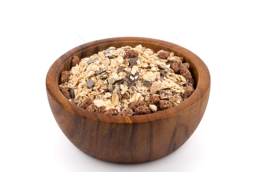 小吃晒干健康的燕麦颗粒含巧克力的麦片和碗中白面巧克力图片