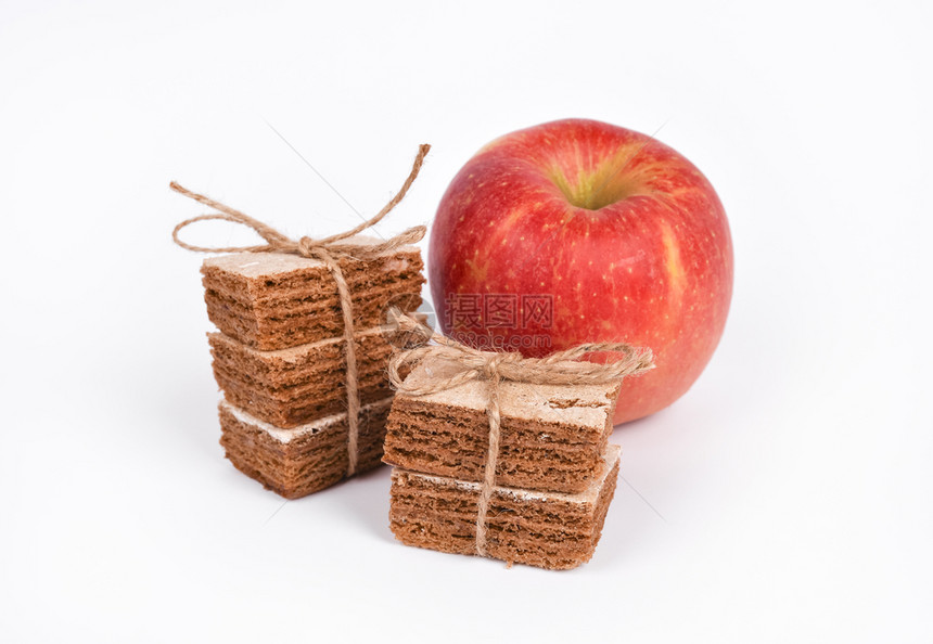 烹饪在白色背景上隔离的苹果软糖和红健康零食概念绑脯图片