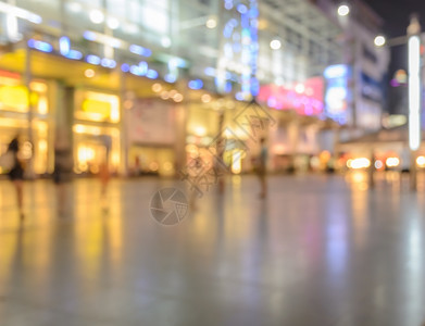 镇闪耀夜光亮的购物中心画面模糊无光旅行背景图片