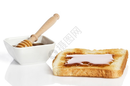 糖蜂蜜吐司罐勺吐司白色背景健康甜的图片