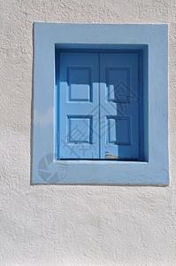 希腊白宫上可爱的蓝色窗玻璃迷人的白色艺术图片