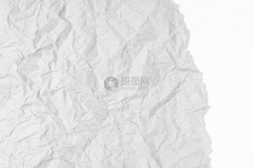 白色纸板纹理上的灰色碎带文本和图形复制空间的白纸背景粗糙的磨损皱图片